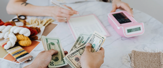 two people calculating money